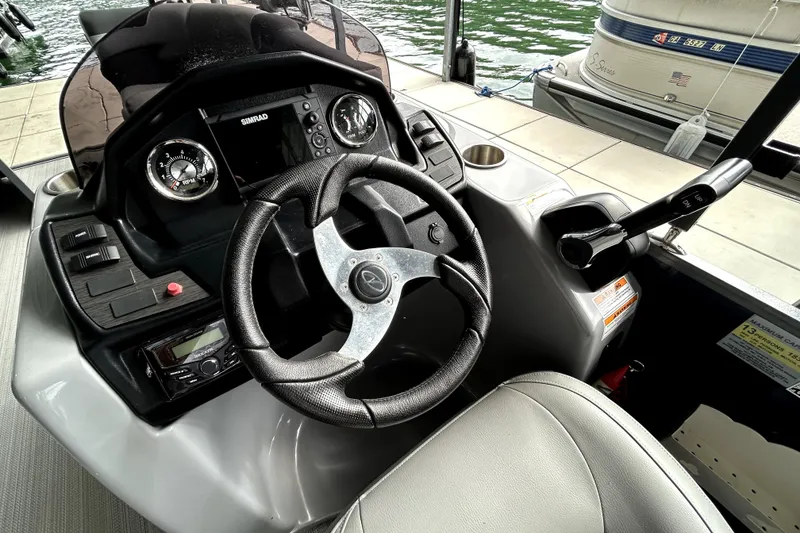 Slide: The Image of Cockpit of 2022 Veranda Relax VR22RC boat with steering wheel and control panel. - 9