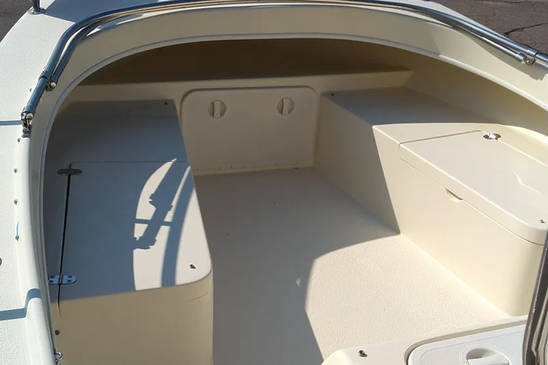 Slide: The Image of 2011 Eastern 20' Center Console boat interior with storage compartments and seating. - 4