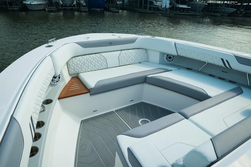 Slide: The Image of Luxurious seating area on 2025 Regal LX43 boat, featuring elegant design and waterfront view. - 13