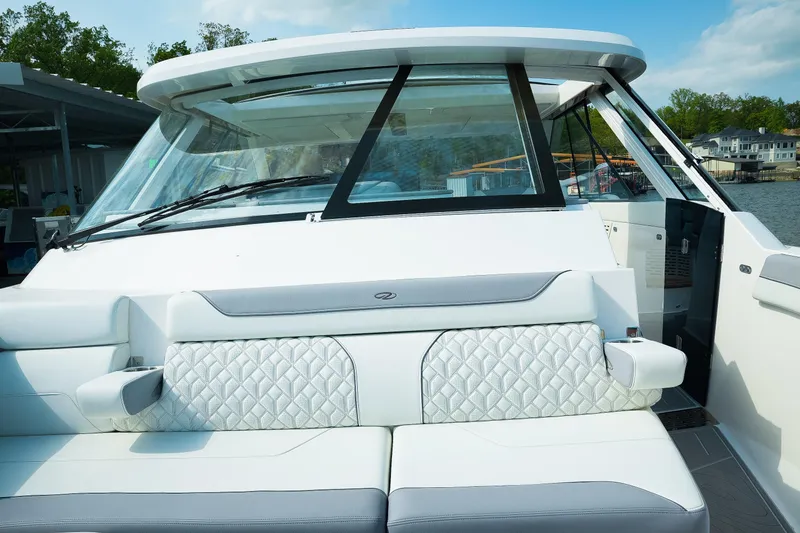 Slide: The Image of 2025 Regal LX43 boat interior with luxurious seating and modern design. - 14