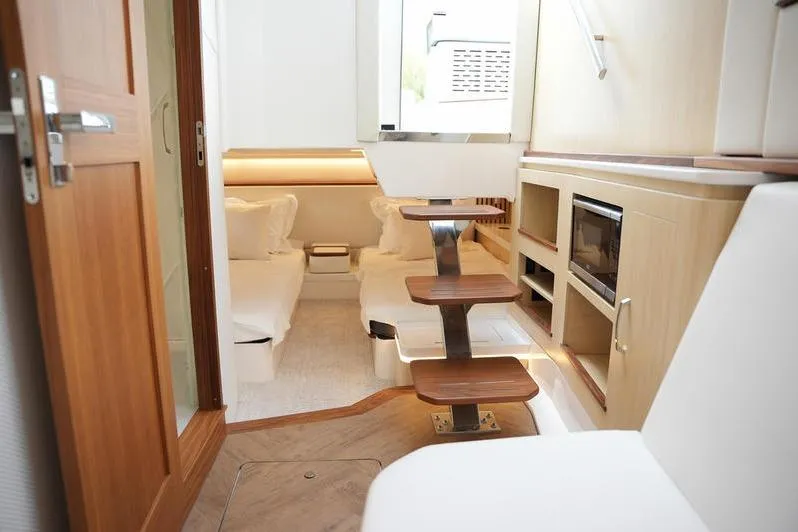 Slide: The Image of Luxurious interior of 2025 Regal LX43 yacht with modern furnishings and elegant design. - 16