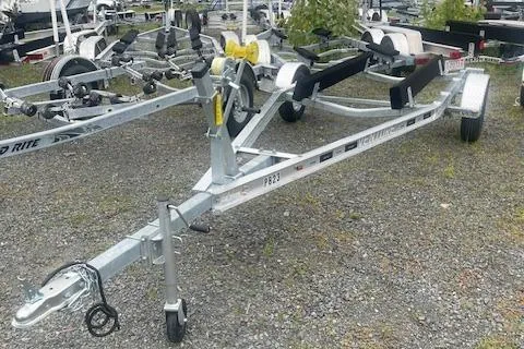 Slide: The Image of Boat trailer for 1964 Boston Whaler 17 Montauk on gravel lot. - 2