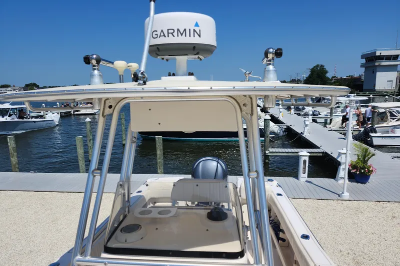 Slide: The Image of 2008 Grady-White Fisherman 222 boat docked with Garmin equipment, sunny marina background. - 14