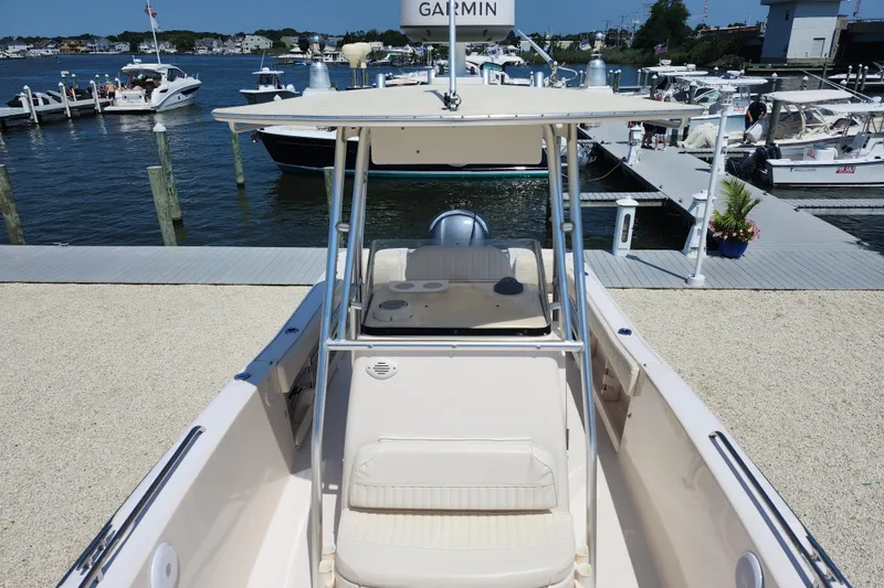 Slide: The Image of 2008 Grady-White Fisherman 222 boat docked at a marina with other vessels. - 15