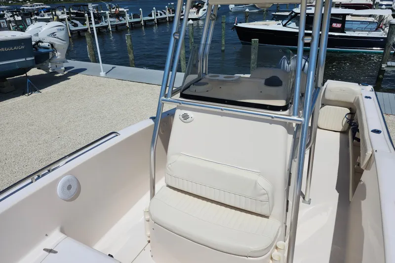 Slide: The Image of 2008 Grady-White Fisherman 222 boat interior at marina, featuring seating and console. - 17