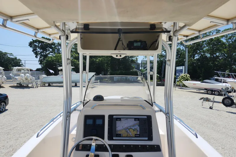 Slide: The Image of 2008 Grady-White Fisherman 222 boat dashboard with navigation equipment, parked in a marina. - 18