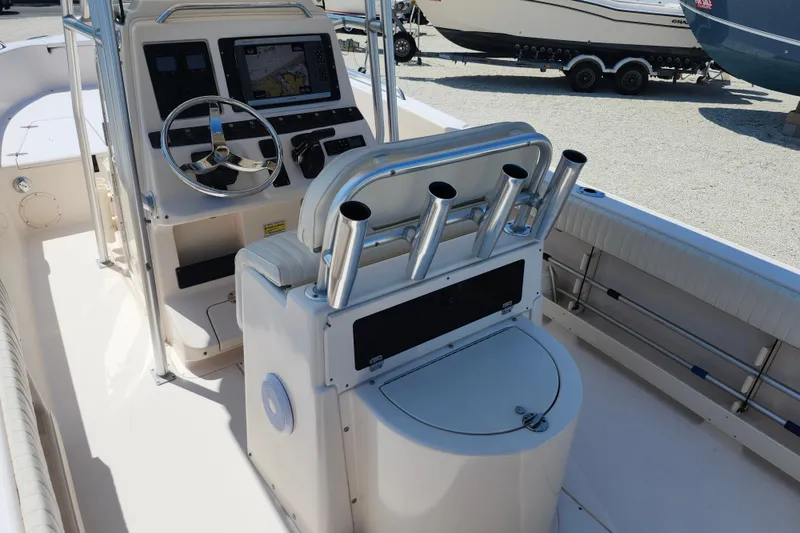 Slide: The Image of 2008 Grady-White Fisherman 222 boat interior with steering console and rod holders. - 21