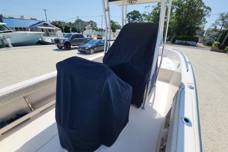 Slide: The Image of 2008 Grady-White Fisherman 222 boat with covered seats, parked outdoors. - 25