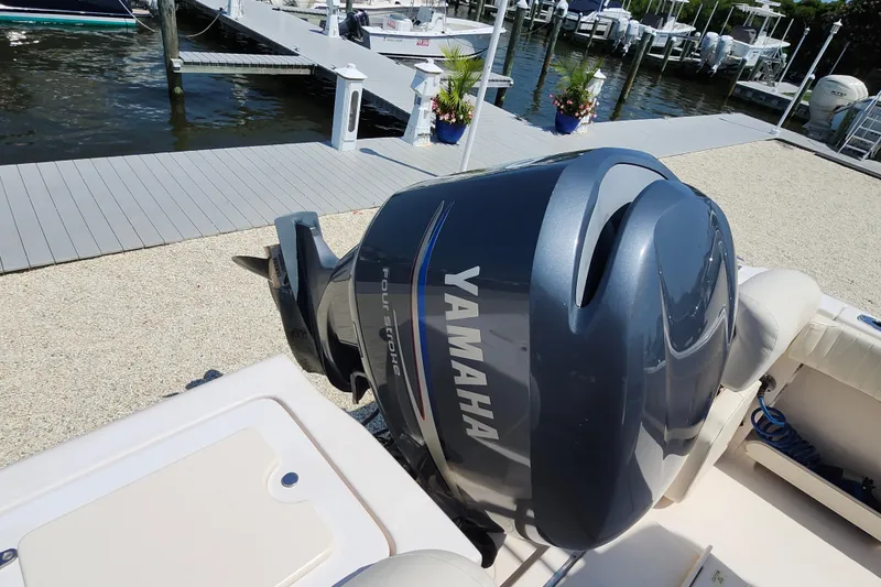 Slide: The Image of 2008 Grady-White Fisherman 222 with Yamaha four-stroke engine at a marina dock. - 28