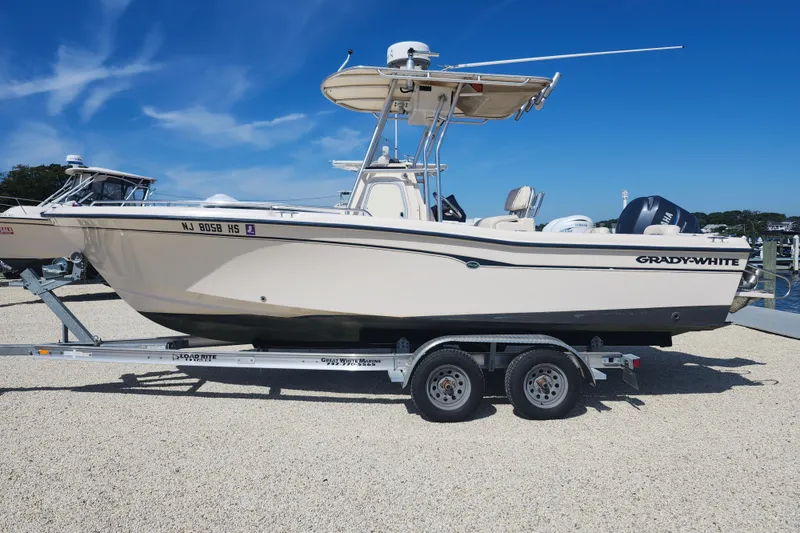 Slide: The Image of 2008 Grady-White Fisherman 222 boat on trailer under clear blue sky. - 3