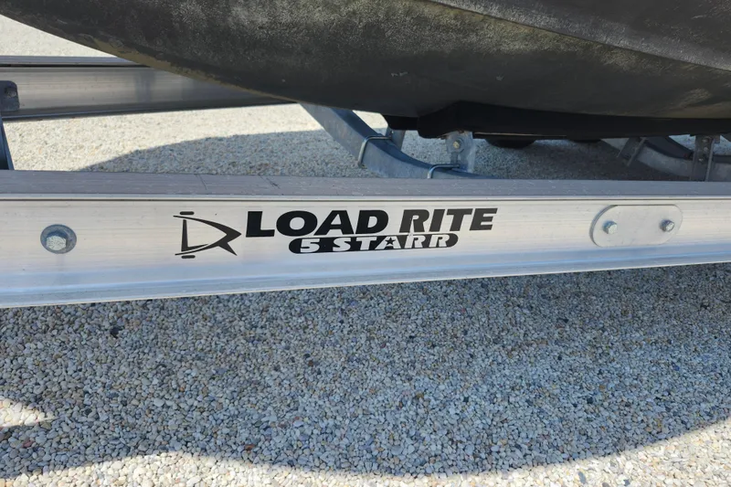 Slide: The Image of Load Rite 5 Starr trailer supporting a 2008 Grady-White Fisherman 222 boat. - 33