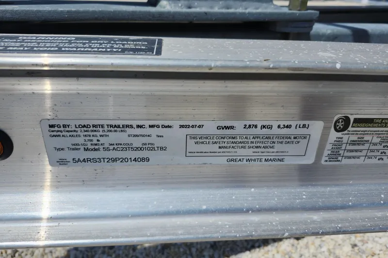 Slide: The Image of Label on Load Rite trailer with specifications and compliance details. - 34