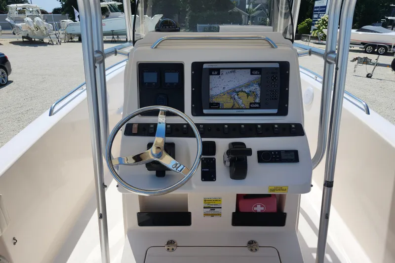 Slide: The Image of Grady-White Fisherman 222 boat dashboard with navigation system, steering wheel, and controls, 2008 model. - 5