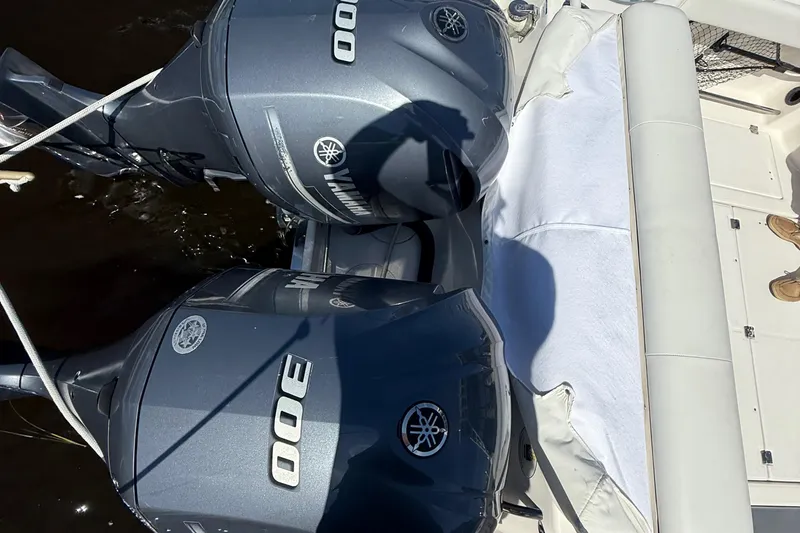 Slide: The Image of Twin Yamaha 300 engines on a 2015 Robalo R305 Walkaround boat. - 30