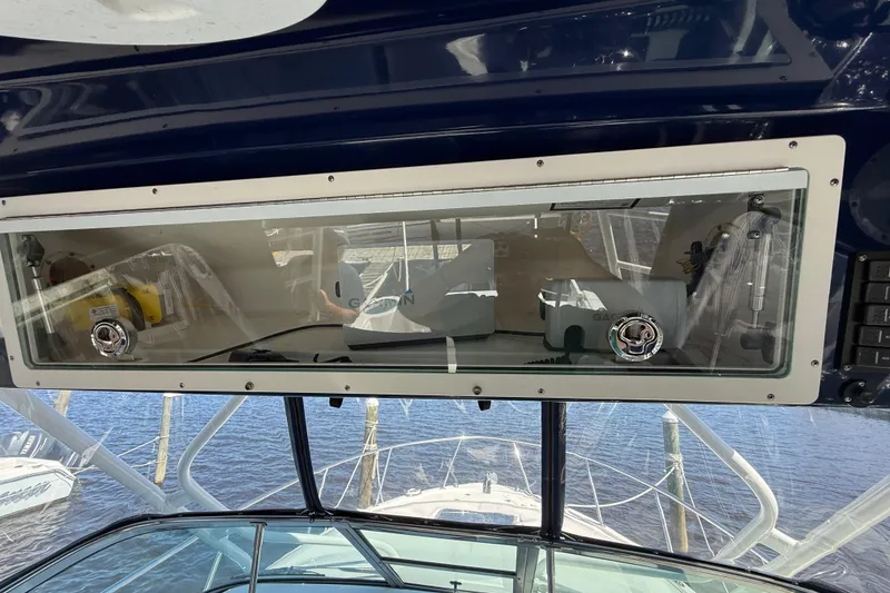 Slide: The Image of 2015 Robalo R305 Walkaround boat dashboard with navigation equipment and controls. - 34