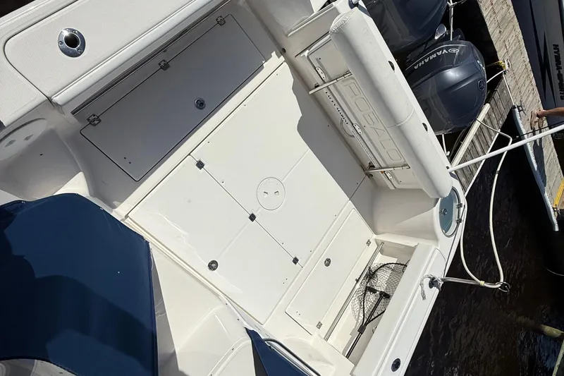 Slide: The Image of 2015 Robalo R305 Walkaround boat deck with Yamaha engines at dock. - 8