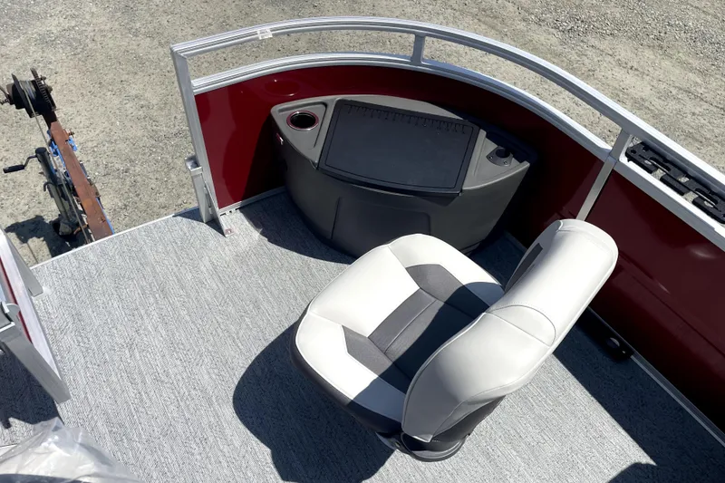 Slide: The Image of 2026 Sun Tracker Fishin' Barge 22 DLX interior with seating and control panel. - 12