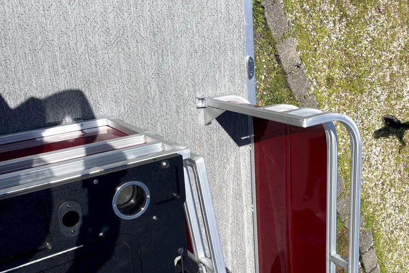 Slide: The Image of 2026 Sun Tracker Fishin' Barge 22 DLX deck and railing detail. - 7