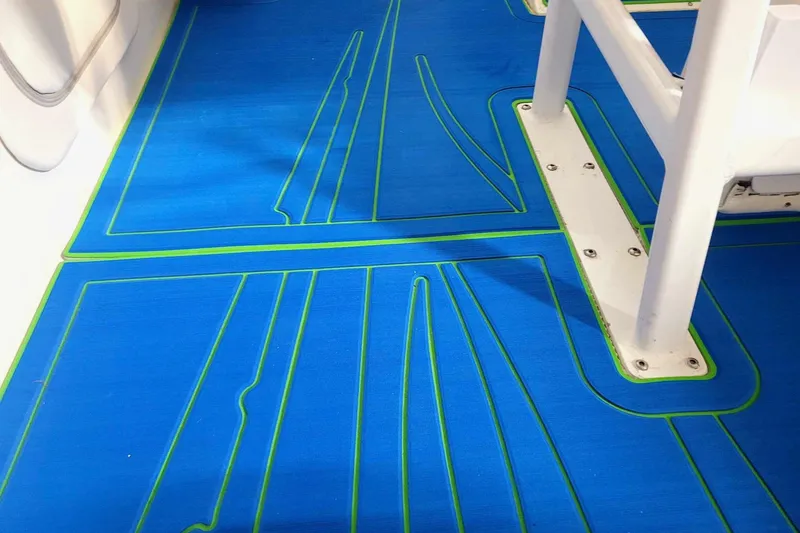 Slide: The Image of Blue and green deck flooring of a 1999 Outerlimits 37 Stiletto boat. - 14
