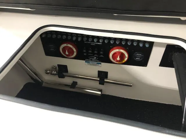 Slide: The Image of 2020 Regal 3300 Bowrider battery management system with control panel and switches. - 17