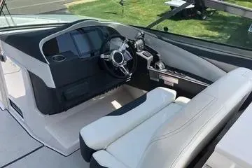 Slide: The Image of 2020 Regal 3300 Bowrider cockpit with modern steering and controls. - 4