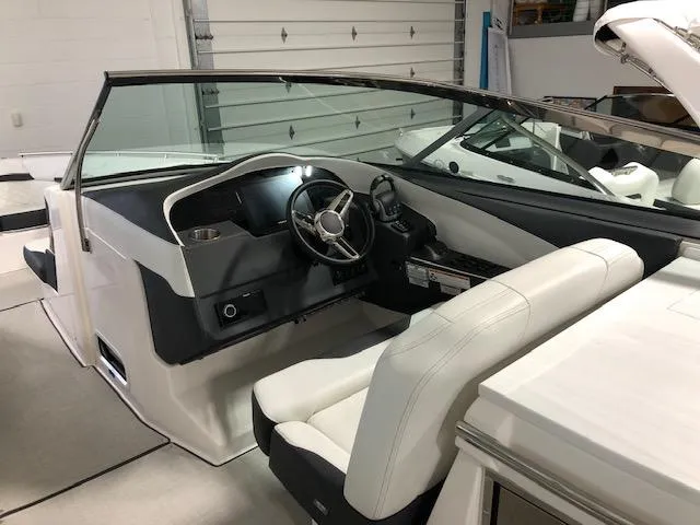 Slide: The Image of 2020 Regal 3300 Bowrider interior with sleek dashboard and comfortable seating. - 6
