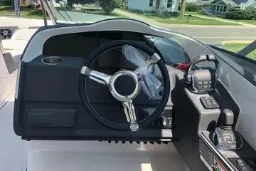 Slide: The Image of 2020 Regal 3300 Bowrider dashboard with steering wheel and controls. - 8