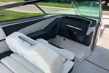 Slide: The Image of 2020 Regal 3300 Bowrider interior with white seating and sleek dashboard design. - 9