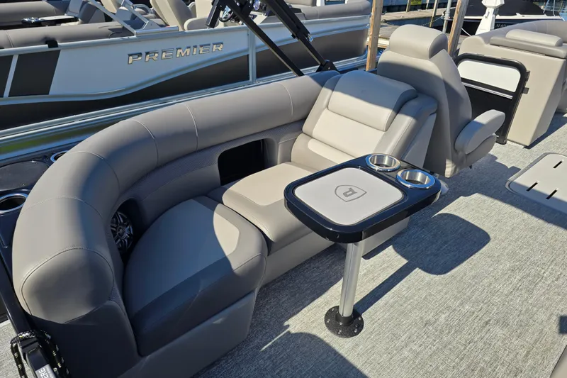 Slide: The Image of Luxurious seating on 2025 Premier 210 Sunsation RF pontoon boat with cup holders. - 8