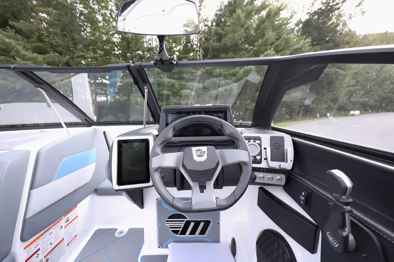 Slide: The Image of 2024 Malibu Wakesetter 23 LSV dashboard with modern steering and digital controls. - 4