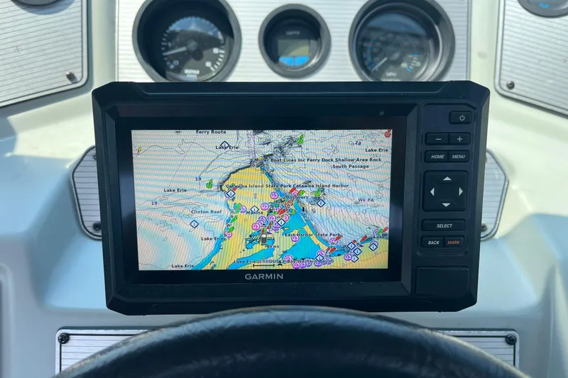 Slide: The Image of Garmin GPS on 1988 Four Winns 235 Sundowner boat dashboard, displaying Lake Erie map. - 10