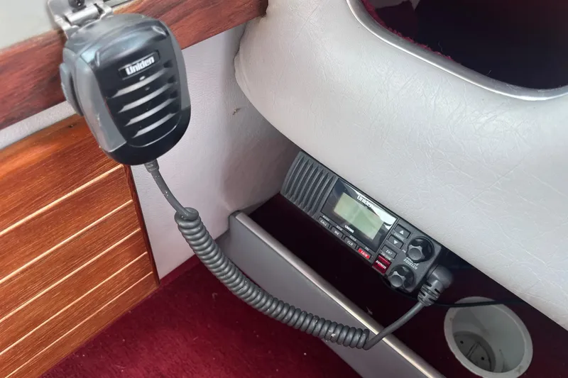 Slide: The Image of 1988 Four Winns 235 Sundowner boat interior with Uniden radio equipment. - 13