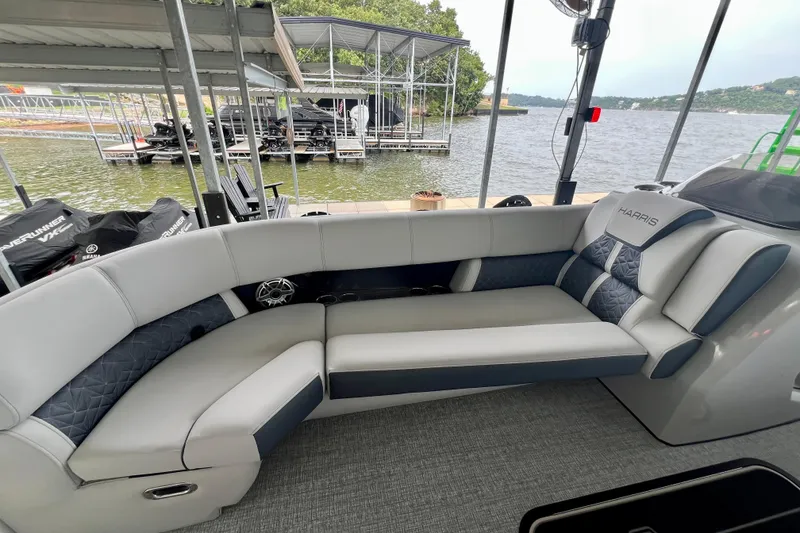 Slide: The Image of Luxurious seating on 2025 Harris Grand Mariner 250 pontoon boat by the lake. - 10