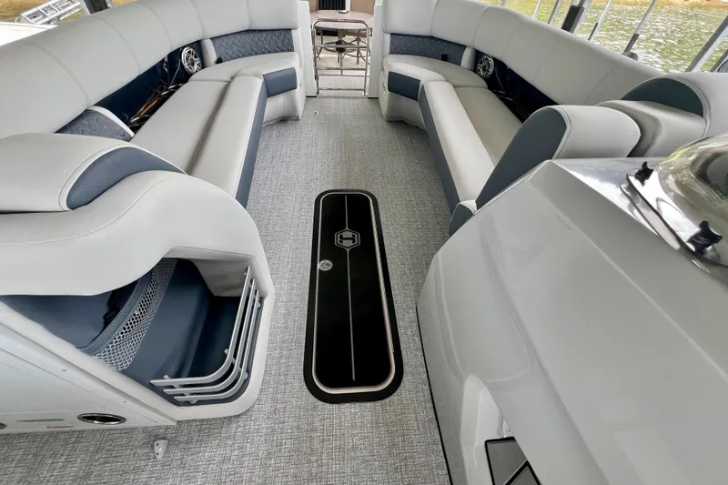 Slide: The Image of Luxurious interior of 2025 Harris Grand Mariner 250 pontoon boat with plush seating. - 12