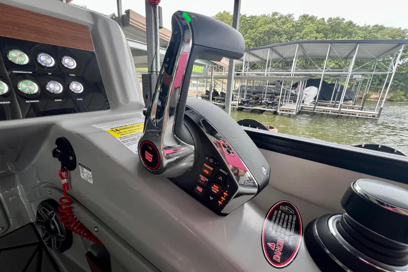 Slide: The Image of Control panel of 2025 Harris Grand Mariner 250 boat with throttle and buttons. - 20
