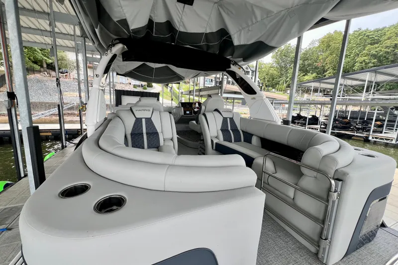 Slide: The Image of 2025 Harris Grand Mariner 250 pontoon boat interior with luxurious seating and modern design. - 28