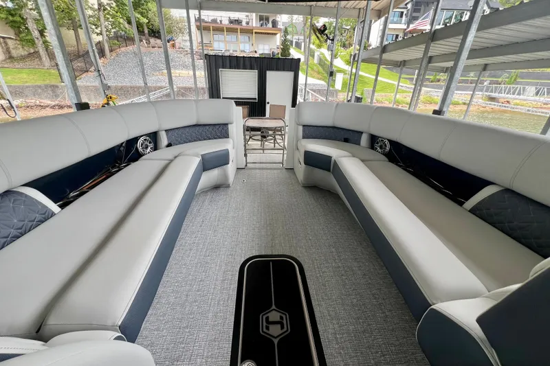 Slide: The Image of 2025 Harris Grand Mariner 250 interior with spacious seating and modern design. - 9