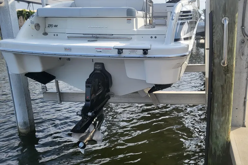 Slide: The Image of 2017 Formula 270 Bowrider boat on lift, rear view showing sterndrive. - 16