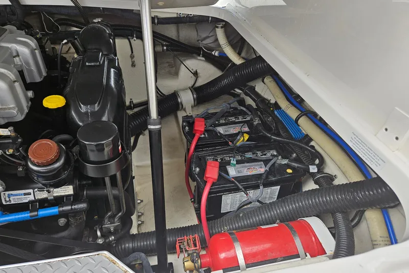 Slide: The Image of Engine compartment of a 2017 Formula 270 Bowrider with batteries and fire extinguisher. - 33