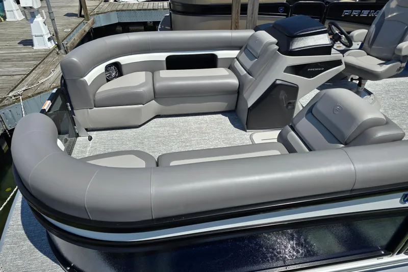 Slide: The Image of 2025 Premier 230 Sunsation RE pontoon boat with luxurious gray seating and modern helm. - 12