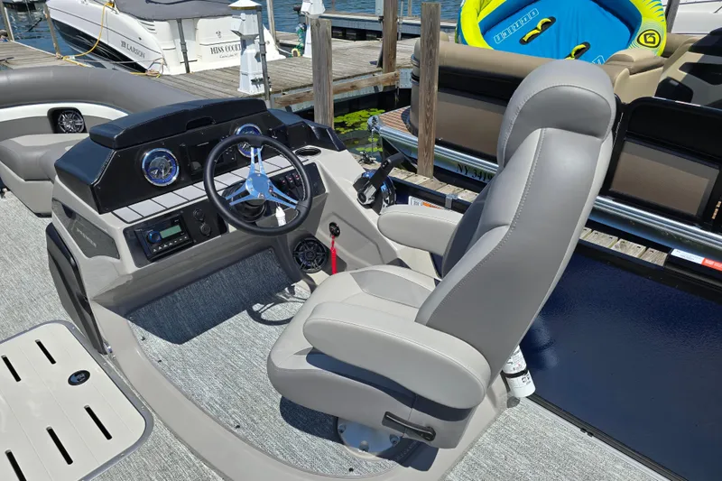 Slide: The Image of Captain's seat and helm of 2025 Premier 230 Sunsation RE pontoon boat. - 15