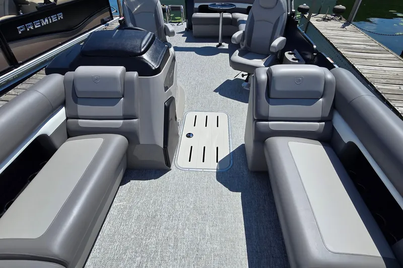 Slide: The Image of 2025 Premier 230 Sunsation RE pontoon boat interior with luxurious seating and modern design. - 18