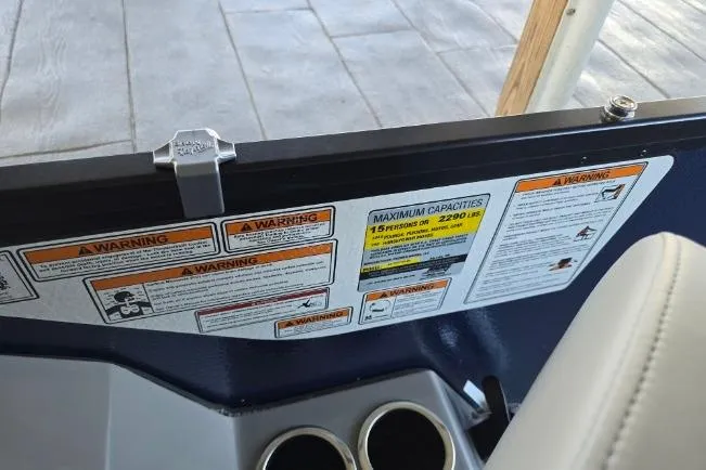 Slide: The Image of 2025 Premier 230 Sunsation RE boat warning labels and capacity information. - 19