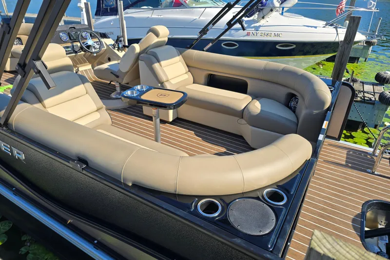 Slide: The Image of 2025 Premier 230 SunSation RF pontoon boat with luxurious seating and modern design. - 4