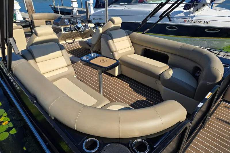 Slide: The Image of Luxurious interior of 2025 Premier 230 SunSation RF pontoon boat with plush seating. - 5