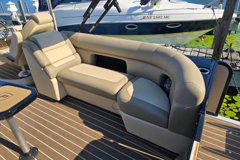 Slide: The Image of Luxurious seating on 2025 Premier 230 SunSation RF pontoon boat at dock. - 6