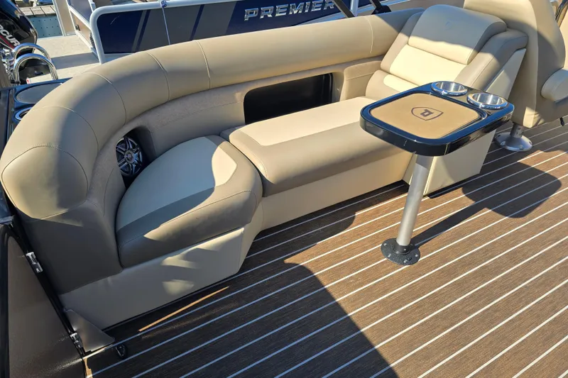 Slide: The Image of Luxurious seating area on 2025 Premier 230 SunSation RF boat with stylish table and cup holders. - 7