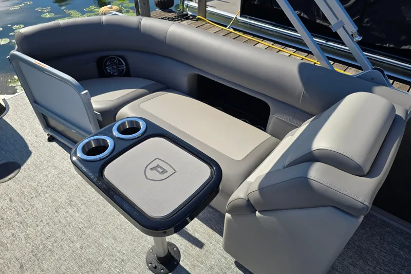 Slide: The Image of Luxurious seating area on 2025 Premier 230 SunSation RF pontoon boat with cup holders. - 14