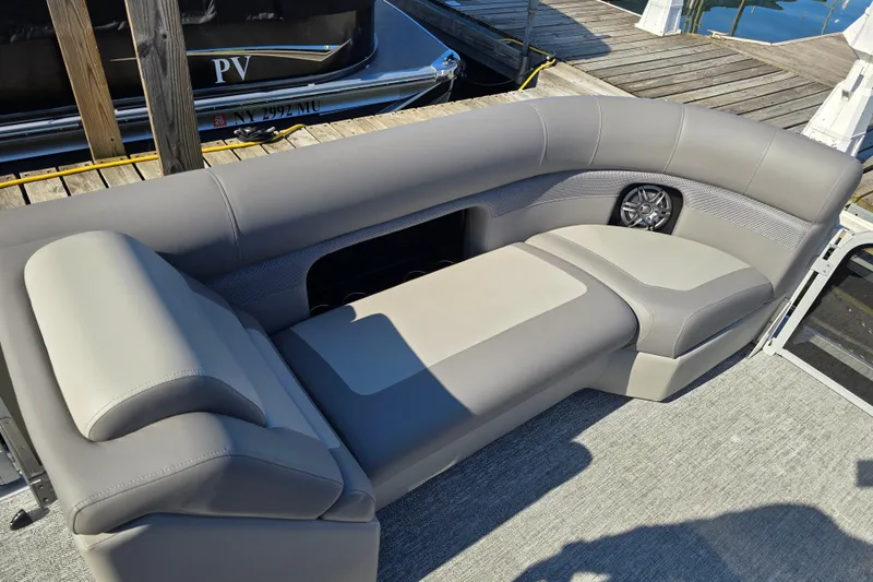 Slide: The Image of Luxurious seating on 2025 Premier 230 SunSation RF pontoon boat at dock. - 20