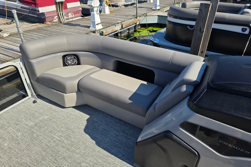 Slide: The Image of Luxurious seating on 2025 Premier 230 SunSation RF pontoon boat at dock. - 21